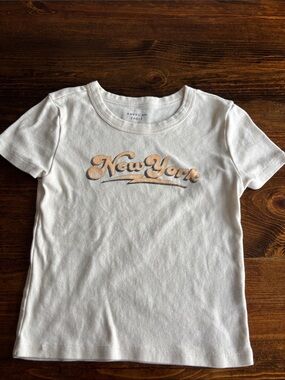 American Eagle Outfitters cream Tee with Peachy-Beige 'New York' Script